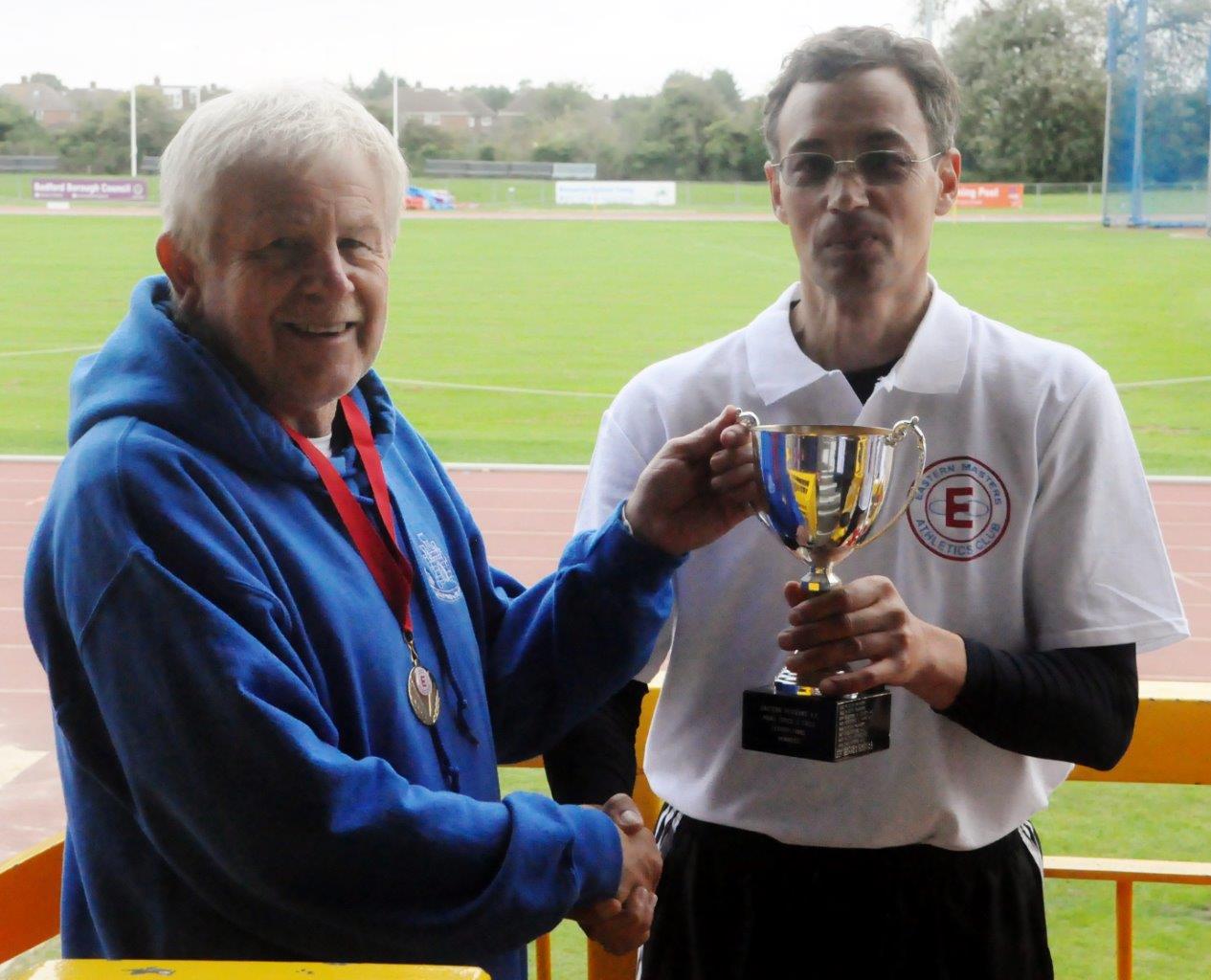 Jim Keech (Bedford) to collect the male team trophy (with Andy Cohen-Wray, who runs Athlete in Mind T&F League sponsor)